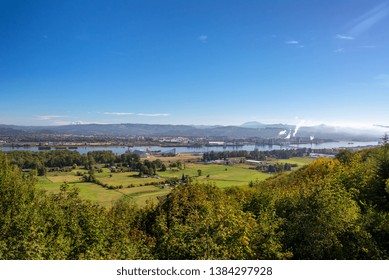 Farmland And Columbia River With Lewis And Clark Bridge Between Oregon And Washington