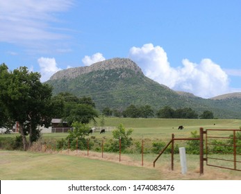 Farmland With The Wichita Mountains In The Background At The Comanche County In Oklahoma.