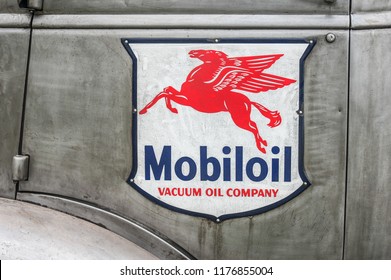 FARNBOROUGH, UK - MARCH 30: Close-up Of A Vintage Mobil Oil Company Badge On Rusting Truck In Farnborough, UK On March 30, 2018