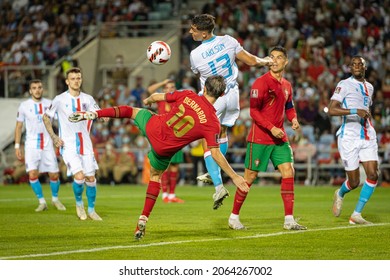 Faro, Algarve - 10 12 2021: Football Match Portugal Vs Luxembourg; Bernardo Silva Tries Bicycle Kick Next To Dirk Carlson