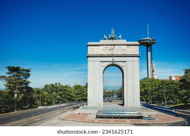 Faro de Moncloa transmission tower and Arc of Victory or Arco Victoria, triumphal arch in Madrid, Spain view from above