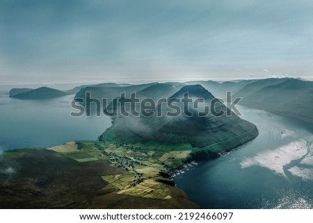 Similar – A big cloud hangs over a fjord