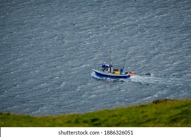 Vágar, Faroe Islands - August 29 2019; A Fishing Boat At Sea.