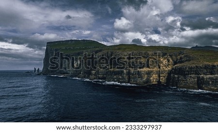 Faroe Islands nature shot with mountains and sea in rough weather
