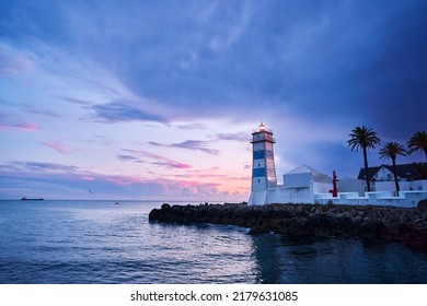Farol Museu de Santa Marta. Lighthouse and Museum in Cascais, Portugal. Beautiful sunset on the sea shore.