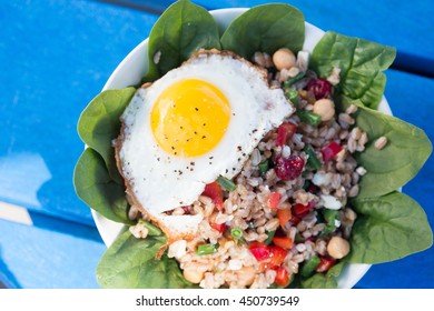 Farro Bowl With
Feta, Chickpeas, Green Beans, Red Peppers,cranberries, Spinach,walnuts,fried Egg And Honey-lemon Vinaigrette