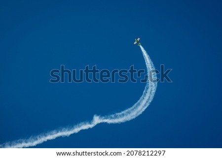 A fascinating shot of an aircraft flying high in the blue sky
