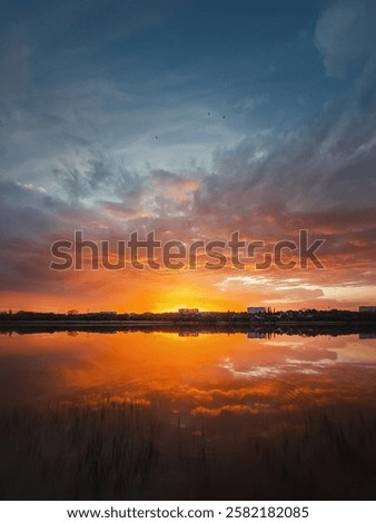 Similar – Image, Stock Photo A tranquil evening scene with typical Dutch houses and a windmill reflected in the calm waters of Zaanse Schans