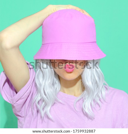 Fashion aesthetic girl in trendy summer accessories. Bucket hat. Street style. Urban. Vanilla Pastel colours