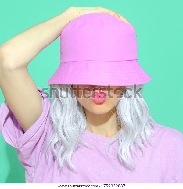 Fashion aesthetic
girl in trendy summer accessories. Bucket hat. Street style. Urban.
Vanilla Pastel colours