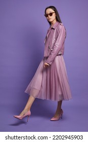 Fashion Asian Female Model. Lilac Leather Jacket, Lilac Skirt, Heels, Sunglasses. Asian Fashion