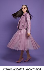 Fashion Asian Female Model. Lilac Leather Jacket, Lilac Skirt, Heels, Sunglasses. Asian Fashion