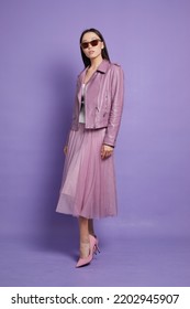 Fashion Asian Female Model. Lilac Leather Jacket, Lilac Skirt, Heels, Sunglasses. Asian Fashion