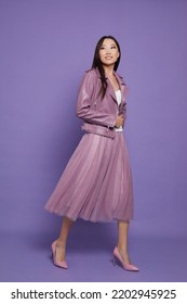 Fashion Asian Female Model. Lilac Leather Jacket, Lilac Skirt, Heels, Sunglasses. Asian Fashion