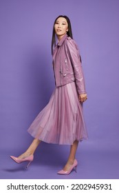 Fashion Asian Female Model. Lilac Leather Jacket, Lilac Skirt, Heels, Sunglasses. Asian Fashion