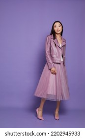 Fashion Asian Female Model. Lilac Leather Jacket, Lilac Skirt, Heels, Sunglasses. Asian Fashion