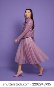 Fashion Asian Female Model. Lilac Leather Jacket, Lilac Skirt, Heels, Sunglasses. Asian Fashion