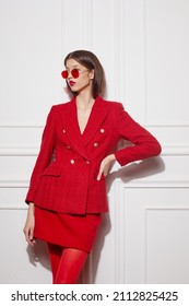 Fashion asian female model in red jacket and skirt. High fashion