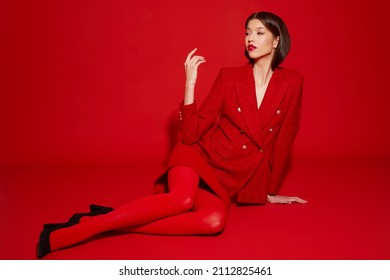 Fashion Asian Female Model In Red Jacket And Skirt. High Fashion