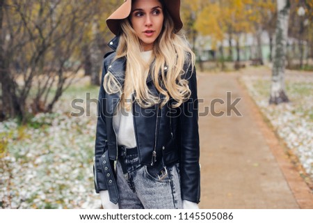 fashion autumn portrait of young happy woman walking outdoor