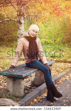 Similar – Foto Bild Herbstportrait eines glücklichen Kindes Mädchens im Garten sitzend