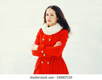 Fashion beautiful young woman wearing a red jacket in winter day
