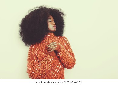 
Fashion Beauty Portrait Of A Beautiful Young Glamorous Black African Woman With Long Curly Hair Wearing Vintage 70s Style Clothes