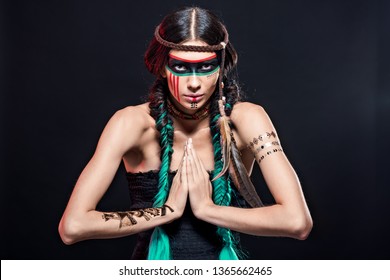 Fashion And Beauty Shooting A Model In The Image Of An Apache Indian In War Paint.