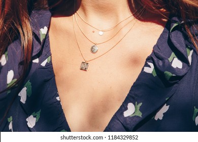 fashion blogger outfit details. fashionable woman wearing a gold chain necklace. detail of a perfect fall fashion outfit.
				