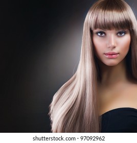 Fashion Blond Girl. Beautiful Makeup and Healthy Hair over Black Background