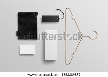 Fashion branding blank mockup scene to place your design, includes packages, tags, labes, pouch, hanger, box. Top view on white background.