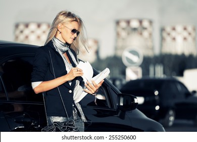 Fashion Business Woman With Financial Papers Next A Car 