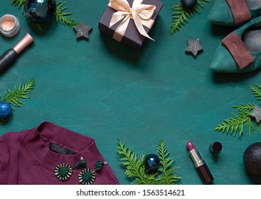 Fashion Christmas New Year Flat Lay On The Wooden Turquoise Background With Cosmetics And Accessories. Top View Concept Winter Holiday Beauty Frame. Copy Space