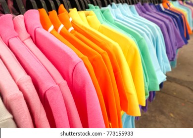 Fashion clothes on clothing rack - bright colorful closet. Close-up of rainbow color choice of trendy female wear on hangers in store closet or spring cleaning concept. Summer home wardrobe. - Shutterstock ID 773155933