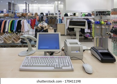 Fashion Clothing Store. Cashier Register, Scanner, Computer On Sales Counter In Shop. 