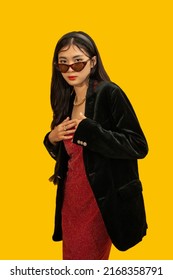 Fashion concept, Fashionable woman wear sunglasses and red dress to posing with oversize black coat.
