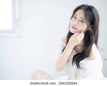 Fashion concept of young asian woman. Beauty photo. Cosmetics. Skin care. Body care.