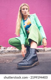 Fashion Content Creator And Social Media Influencer In Neon Clothes And Cool Modern Pose Outdoors On The Road. Photography, Green And Portrait Of A Young Woman On The City Street Against A Pink Wall