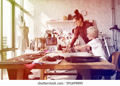 Fashion designer brainstorming and sharing ideas - Powered by Shutterstock