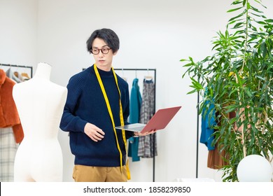 Fashion Designer Concept. Young Asian Man Working In Office.