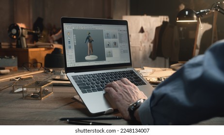 Fashion designer creates clothes and develops future wear collection in 3D modeling program. Male tailor works in luxury designer workshop or tailoring studio on laptop. Fashion concept. - Powered by Shutterstock