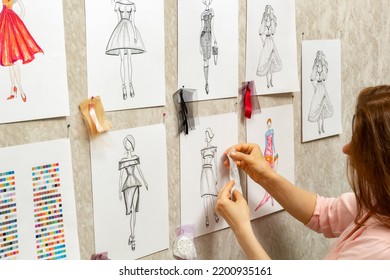 	
The fashion designer develops sketches of clothing design. The artist creates women's dresses. Tailor working with fabric. - Powered by Shutterstock