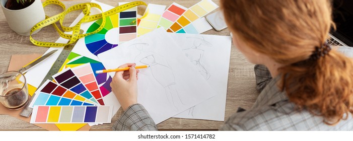 Fashion designer drawing new sketches, working on new collection in atelier, panorama - Shutterstock ID 1571414782