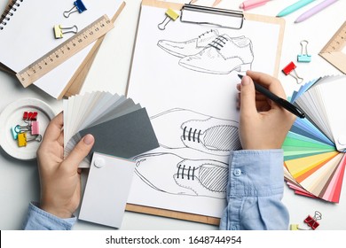 Fashion Designer Drawing Shoes At Table, Top View