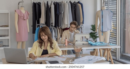 Fashion designer is focused on selecting colors for new clothing collection in studio. The workspace is filled with creative tools, fabric samples, sewing machine, vibrant process of fashion design - Powered by Shutterstock