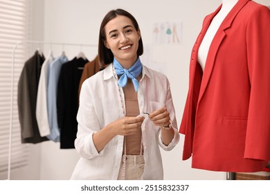 Fashion designer with needles working in workshop - Powered by Shutterstock