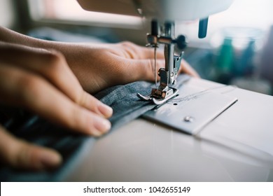 Fashion designer sewing his new dress at studio. - Powered by Shutterstock