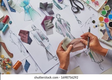 Fashion designer stylish drawings sketches textile fabric material Costume. Designer creative workshop studio.                          - Powered by Shutterstock