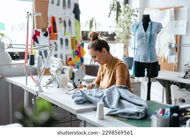 Fashion designer using a sewing machine at her workplace
 - Powered by Shutterstock