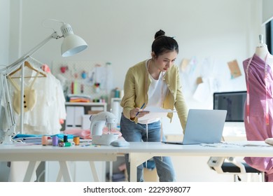 fashion designer woman Happy to design clothes at work. - Powered by Shutterstock